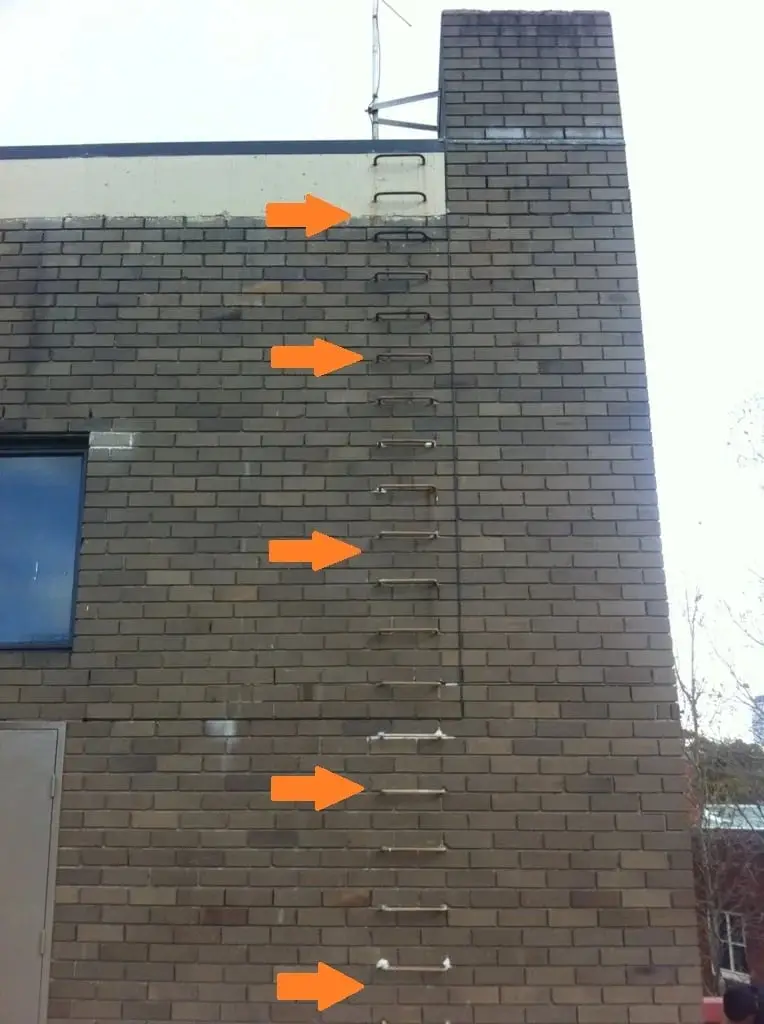 Old rungs in the brick, Step rungs marked with arrows.
