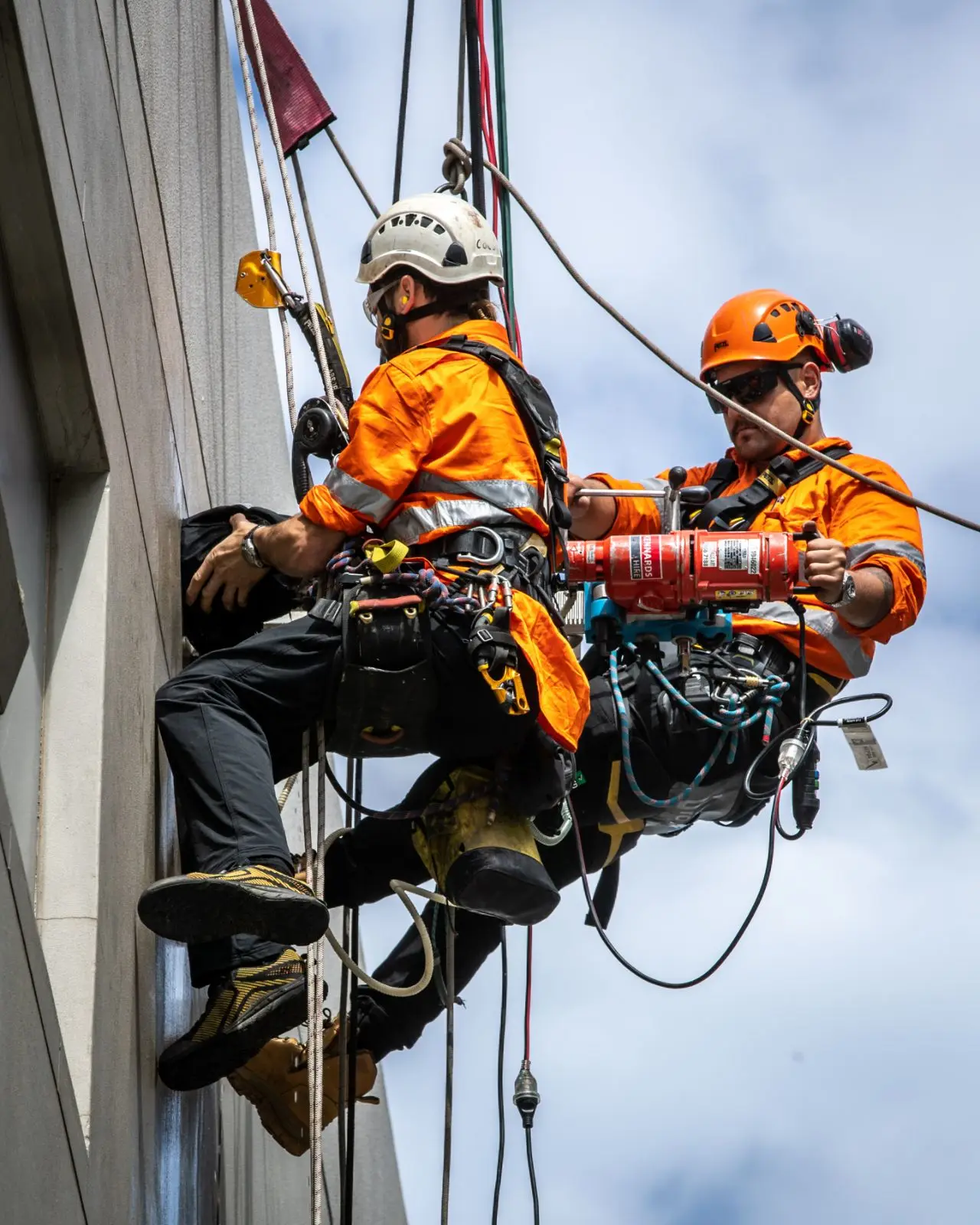 Two technicians on the facade, 450 Miller St, Cammeray
