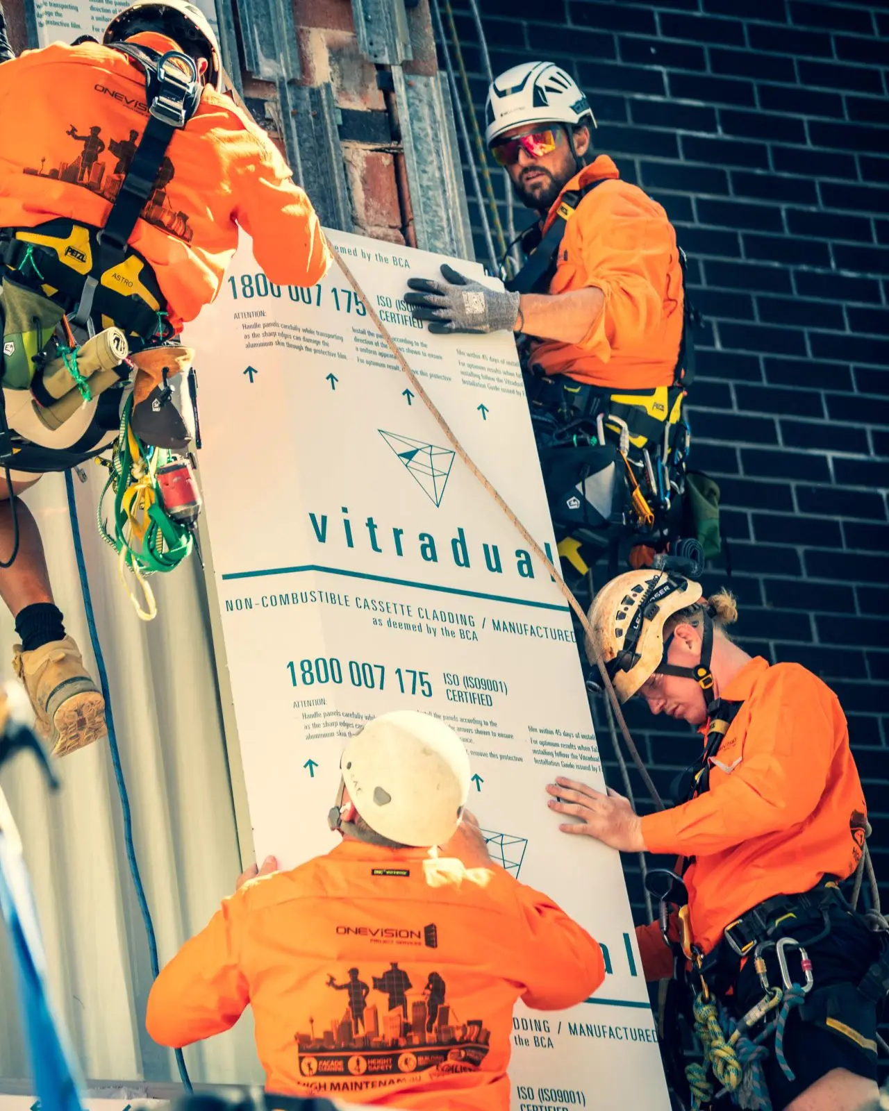 Three-person panel install, Building D · 2021