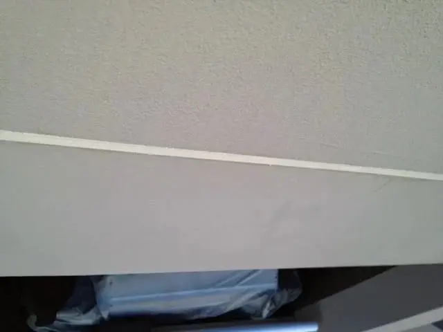 Finished joint, A painted horizontal joint along a wall above a balcony.