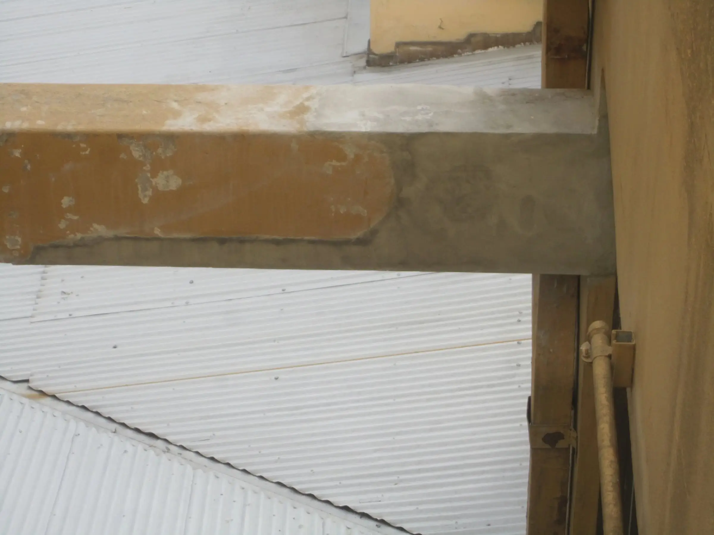 Beam patched, The same beam with the concrete reinstated, before painting.