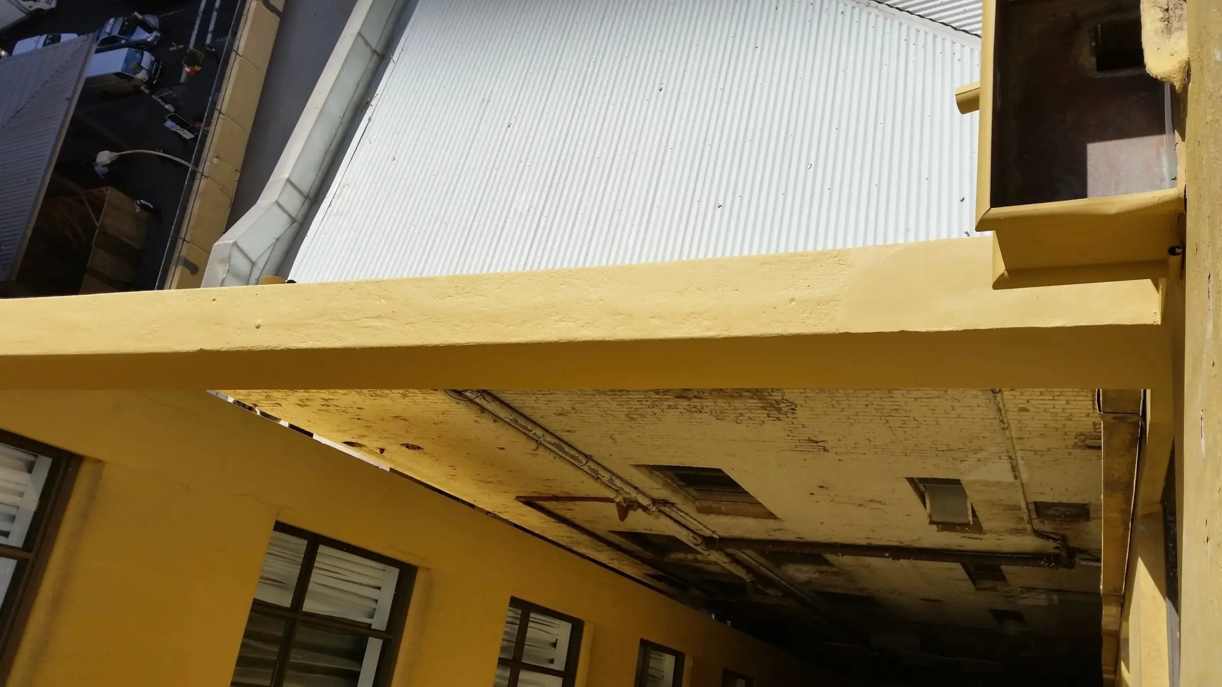 Beam repaired and painted, The repaired beam after painting, seen from below.