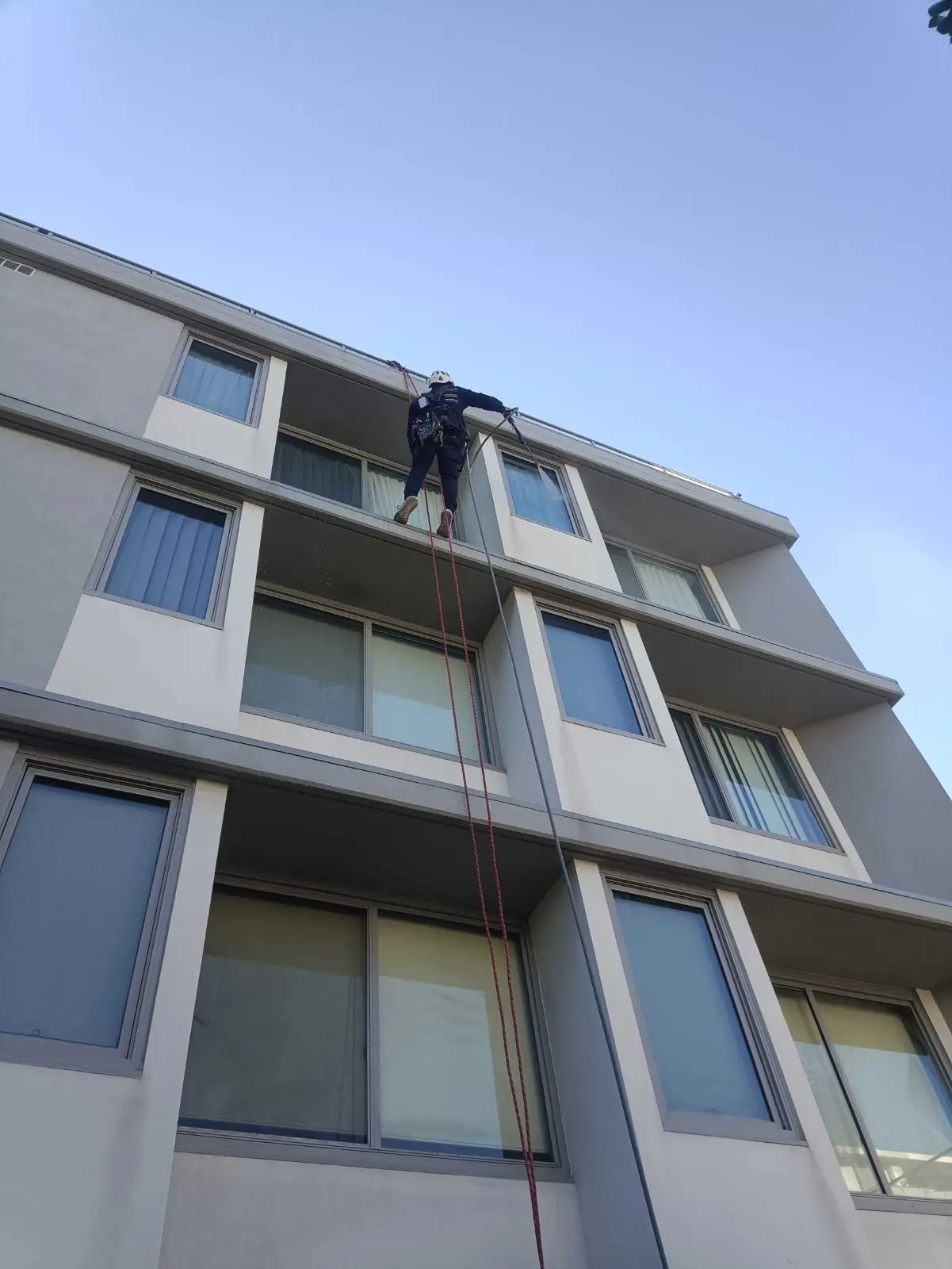 At the parapet, top floor, Kogarah · 2026