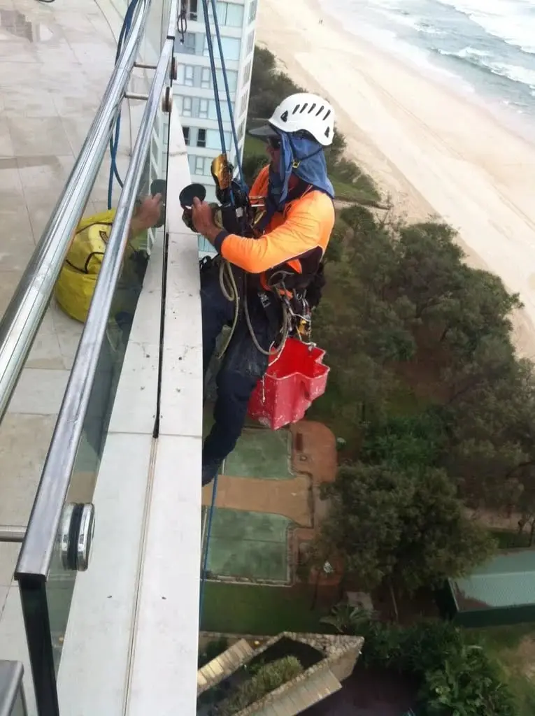 Removing the old balustrade sealant on ropes, Jade Apartments · 2011–12