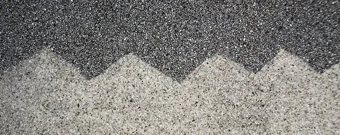Before and after, An aggregate surface, part cleaned.
