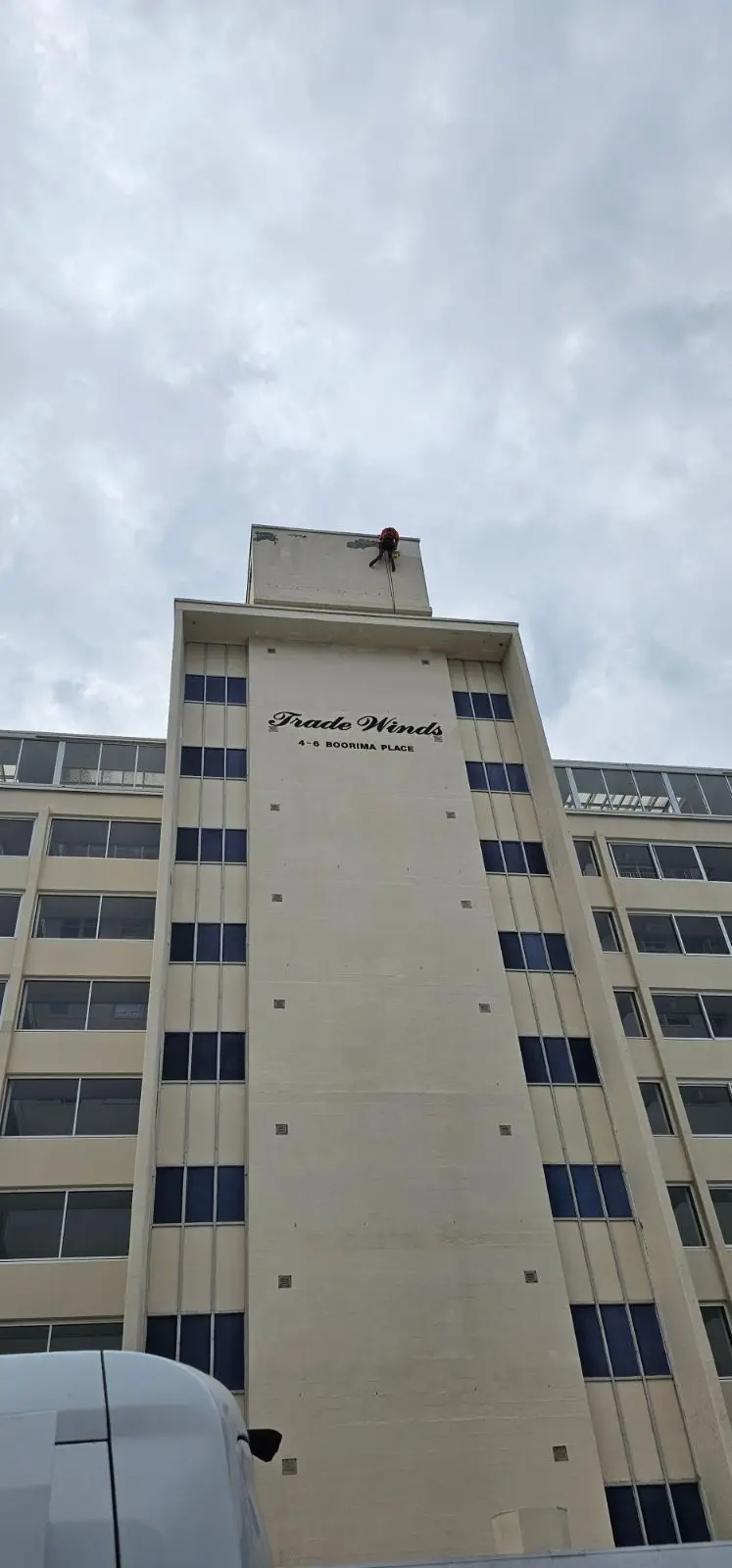 Technician on the sign tower, Tradewinds, Cronulla